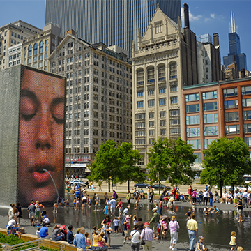 People gather in front of the Crown Fountain in Chicago's Millennium Park